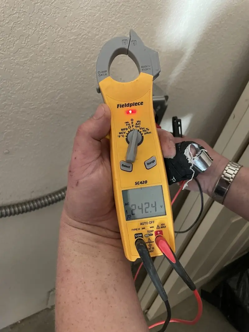 Voltage testing with clamp meter during Ceiling Fan Installation in Mansfield